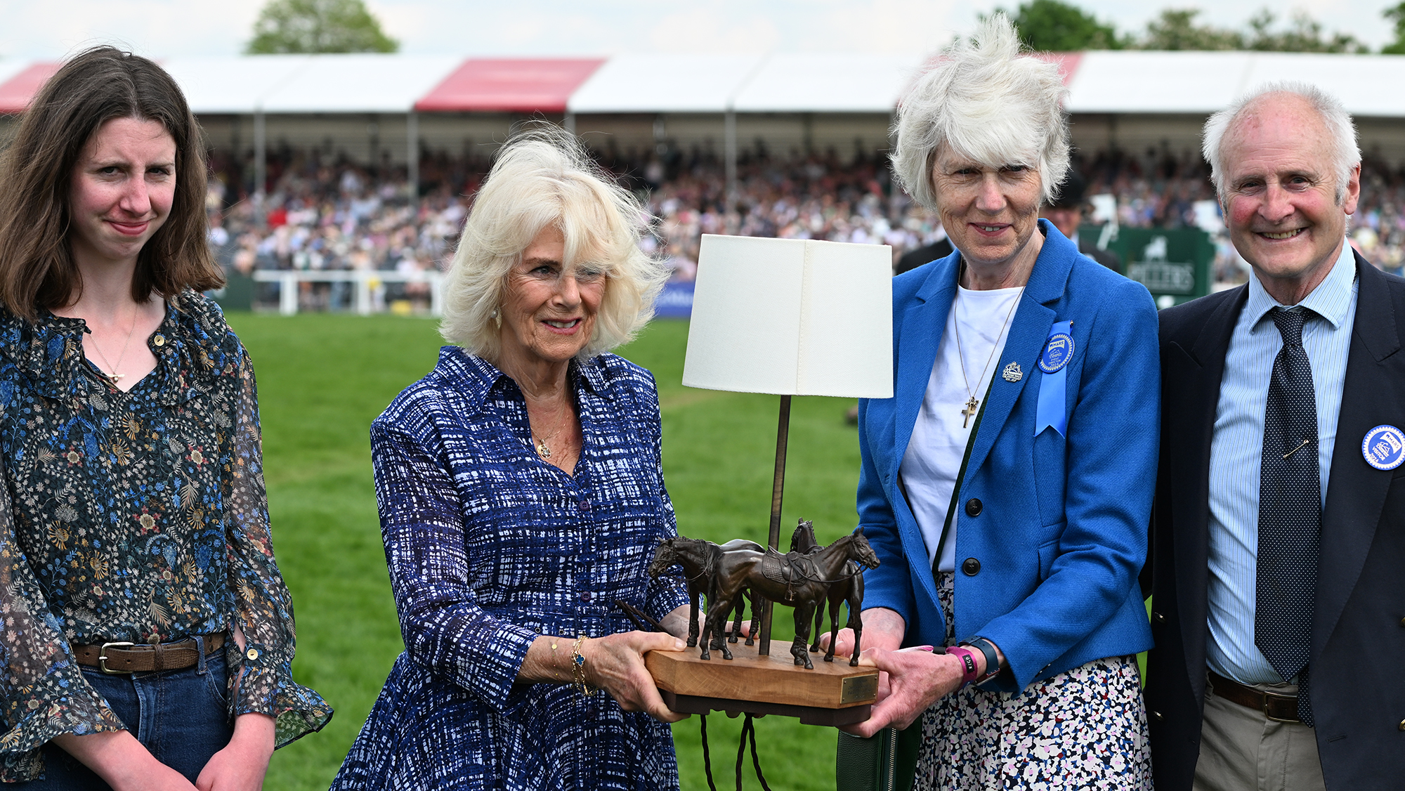 The Queen at Badminton Horse Trials in 2024, making a presentation to event director Jane Tuckwell to mark her 50 years working at the event.