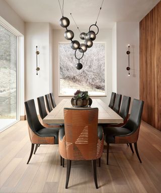 modern neutral dining room with wooden table and black chairs
