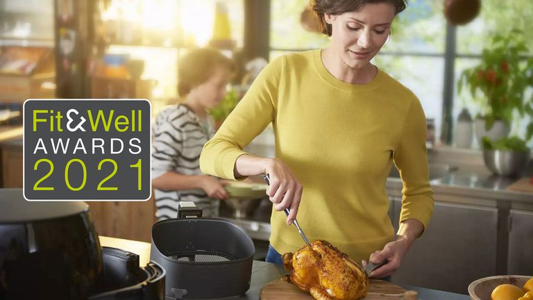 Woman using the Philips Airfryer XXL