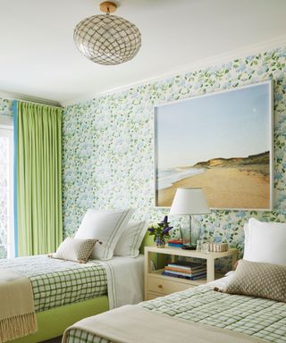 guest room with green scheme twin beds and floral wallcovering