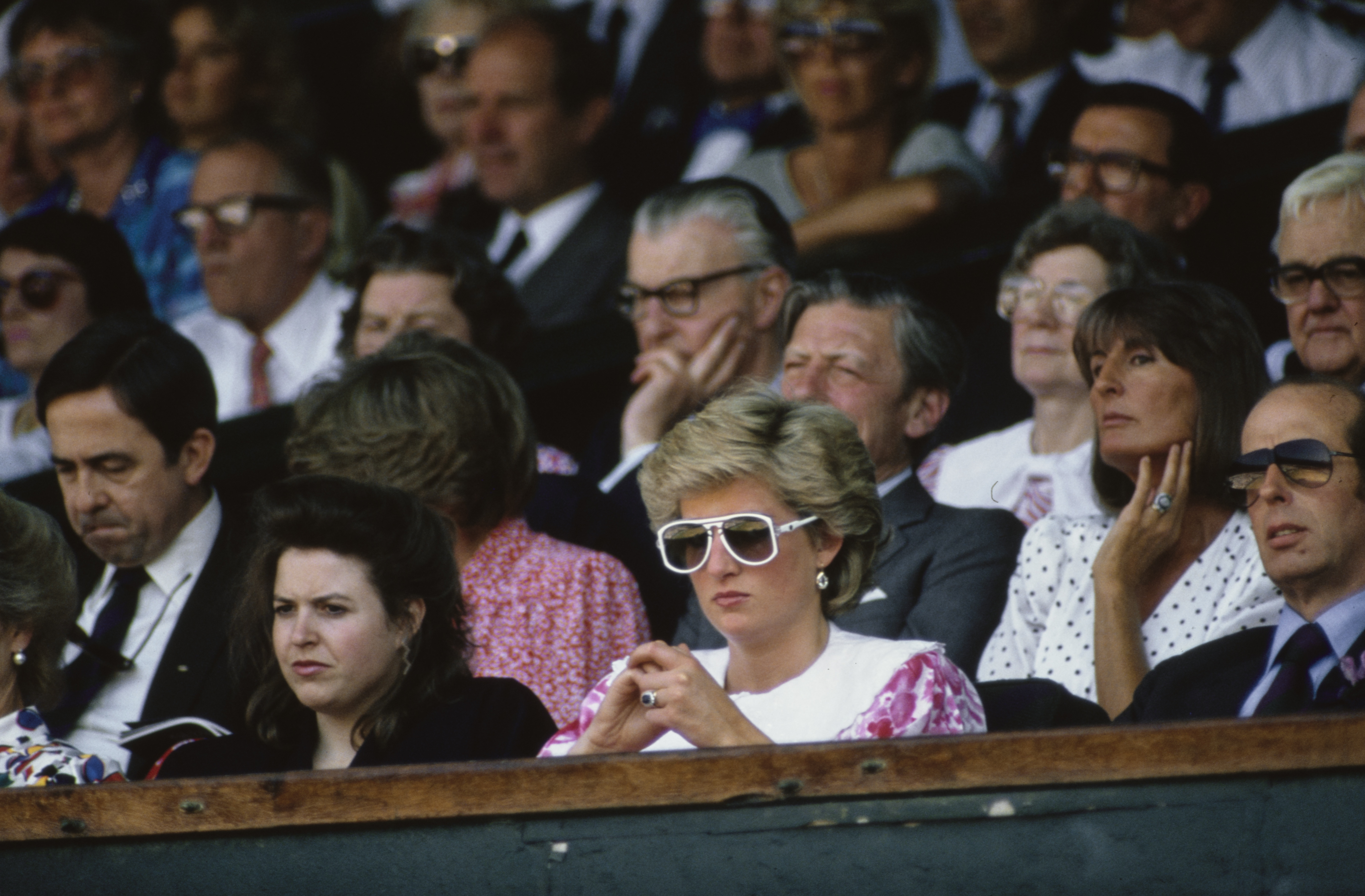 Princess Diana wearing a pink dress and white sunglasses at Wimbledon 1987