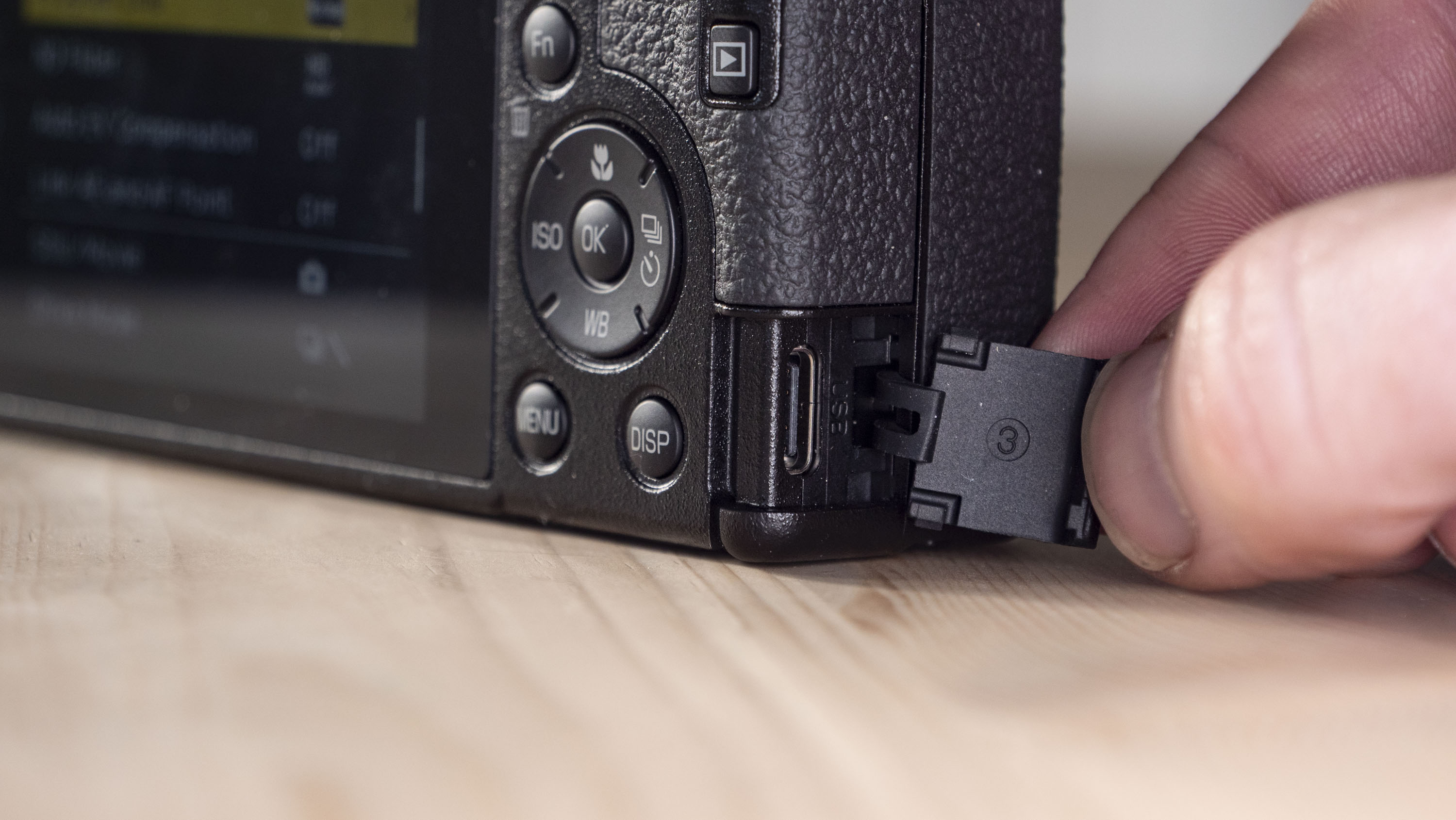 Closeup of the Ricoh GR IV compact camera's USB-C port