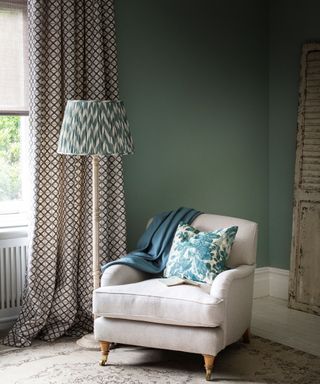 Green room, armchair, vintage rug