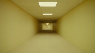 A24's The Backrooms movie trailer screenshot showing a long corridor with yellow wallpaper