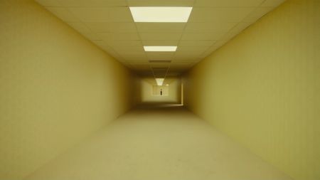 A24's The Backrooms movie trailer screenshot showing a long corridor with yellow wallpaper