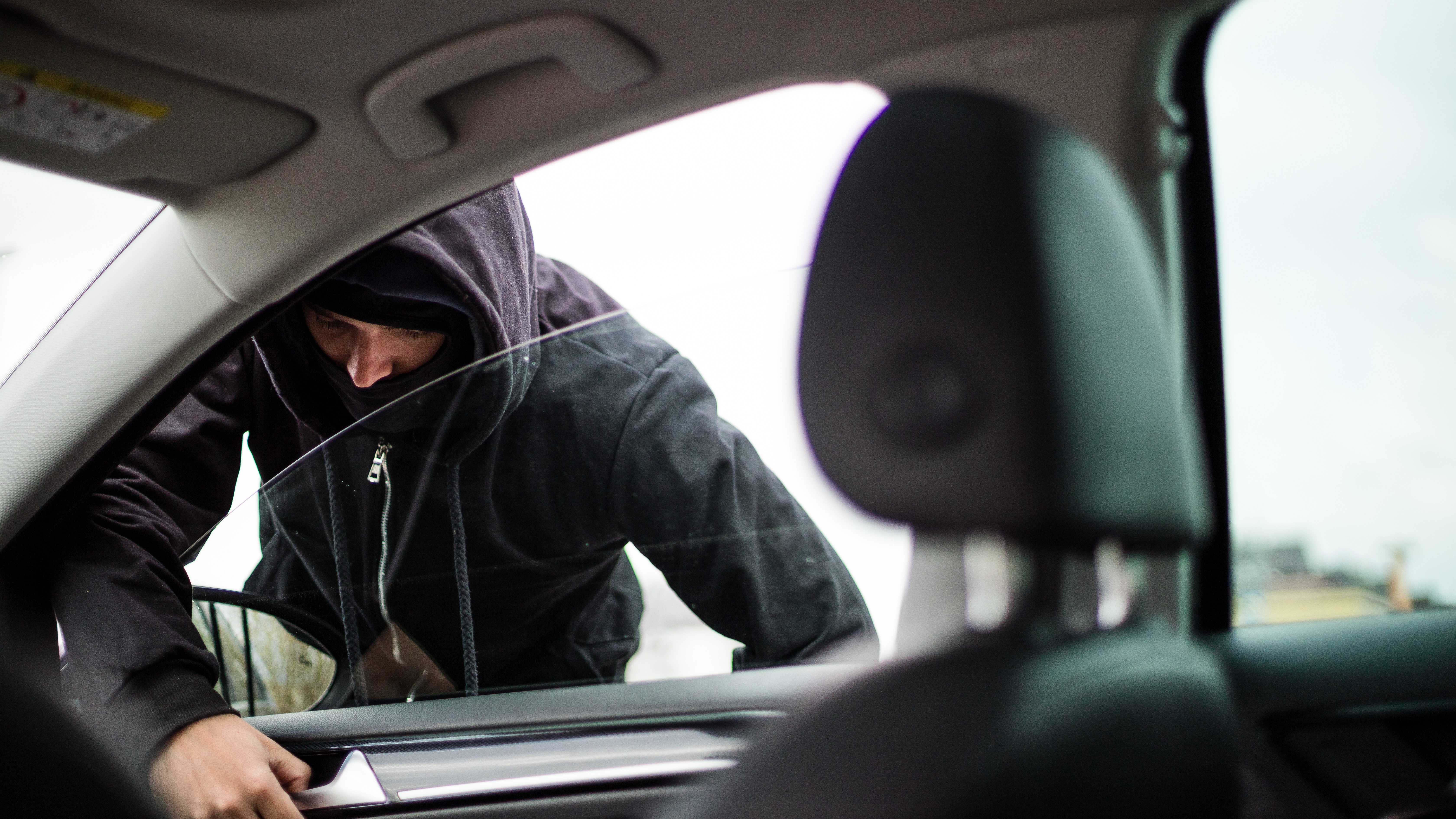 Man breaking into a car