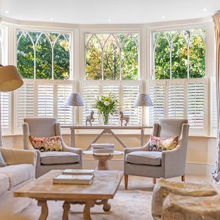 reception room with bay window and gas fire