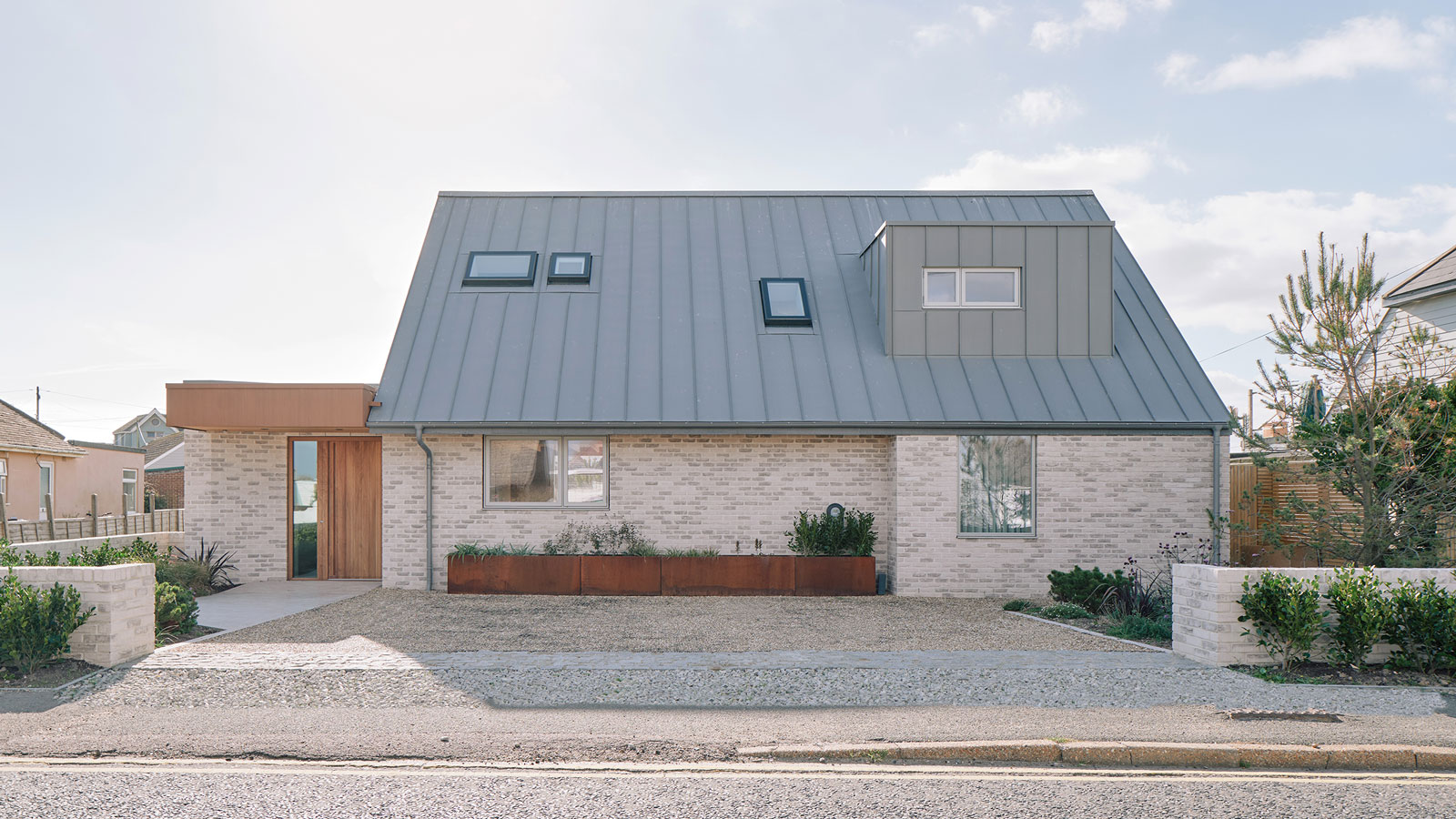 modern single storey house with dropped kerb to driveway