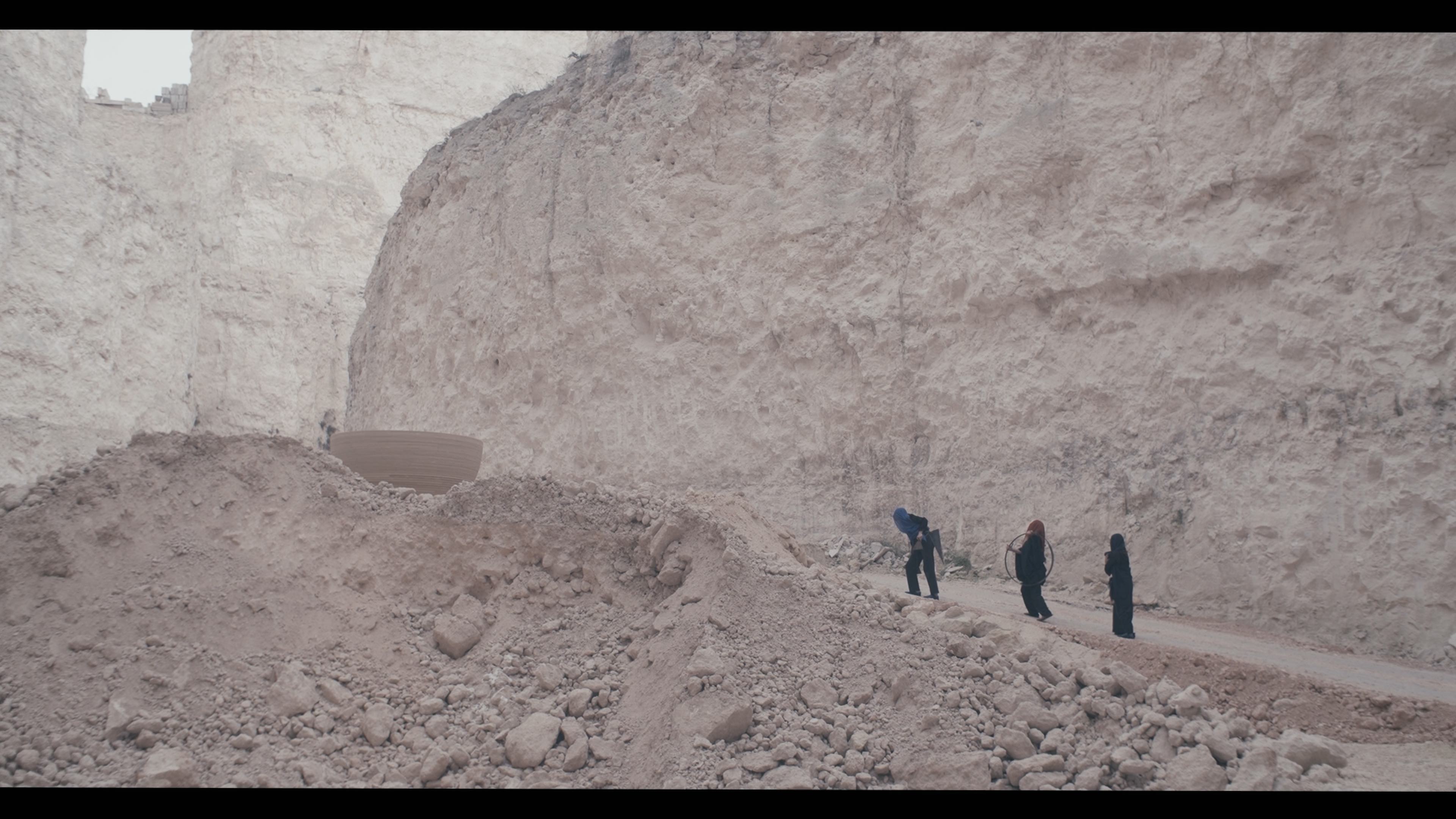 three women in duty stone quarry