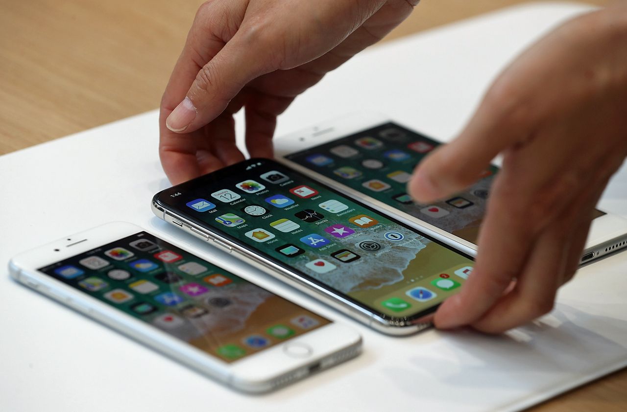 CUPERTINO, CA - SEPTEMBER 12:(L-R) The new iPhone 8, iPhone X and iPhone 8S are displayed during an Apple special event at the Steve Jobs Theatre on the Apple Park campus on September 12, 201