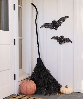 Porch decorated with pumpkins and halloween deor