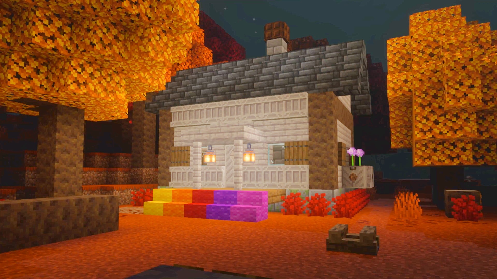 A house and some orange-leaved trees in the Dappled Forest Minecraft biome.