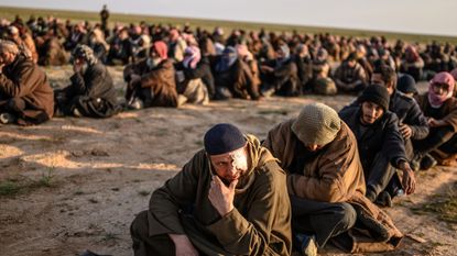 Suspected Isis fighters in Baghouz, Syria