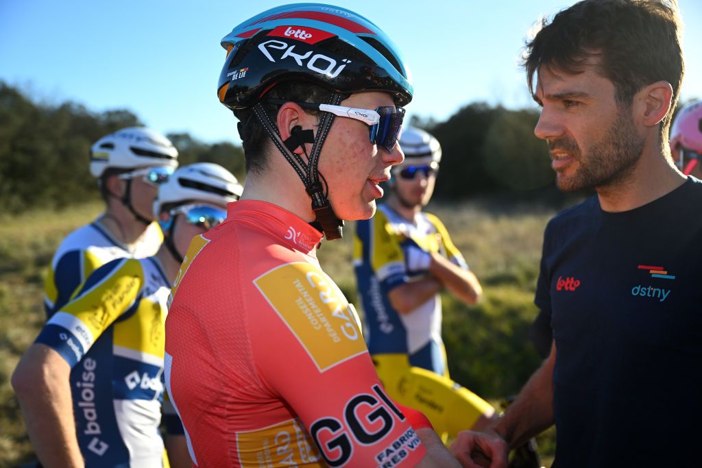 AUBAIS FRANCE FEBRUARY 02 Arnaud De Lie of Belgium and Team Lotto Dstny Orange leader Jersey waits after the neutralization of the stage due to a massive crash during the 53rd Etoile de Besseges Tour Du Gard 2023 Stage 2 a 16963km stage from Bagard to Aubais EDB2021 on February 02 2023 in Aubais France Photo by Luc ClaessenGetty Images
