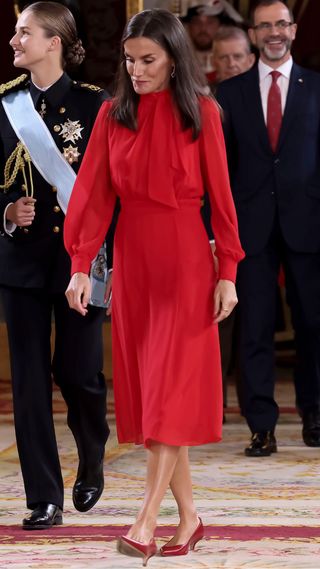 Queen Letizia wearing red midi dress and matching red kitten heels