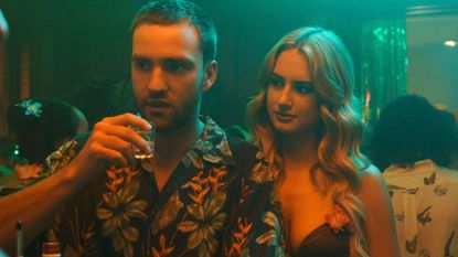 Stephen and Lucy drink at a party