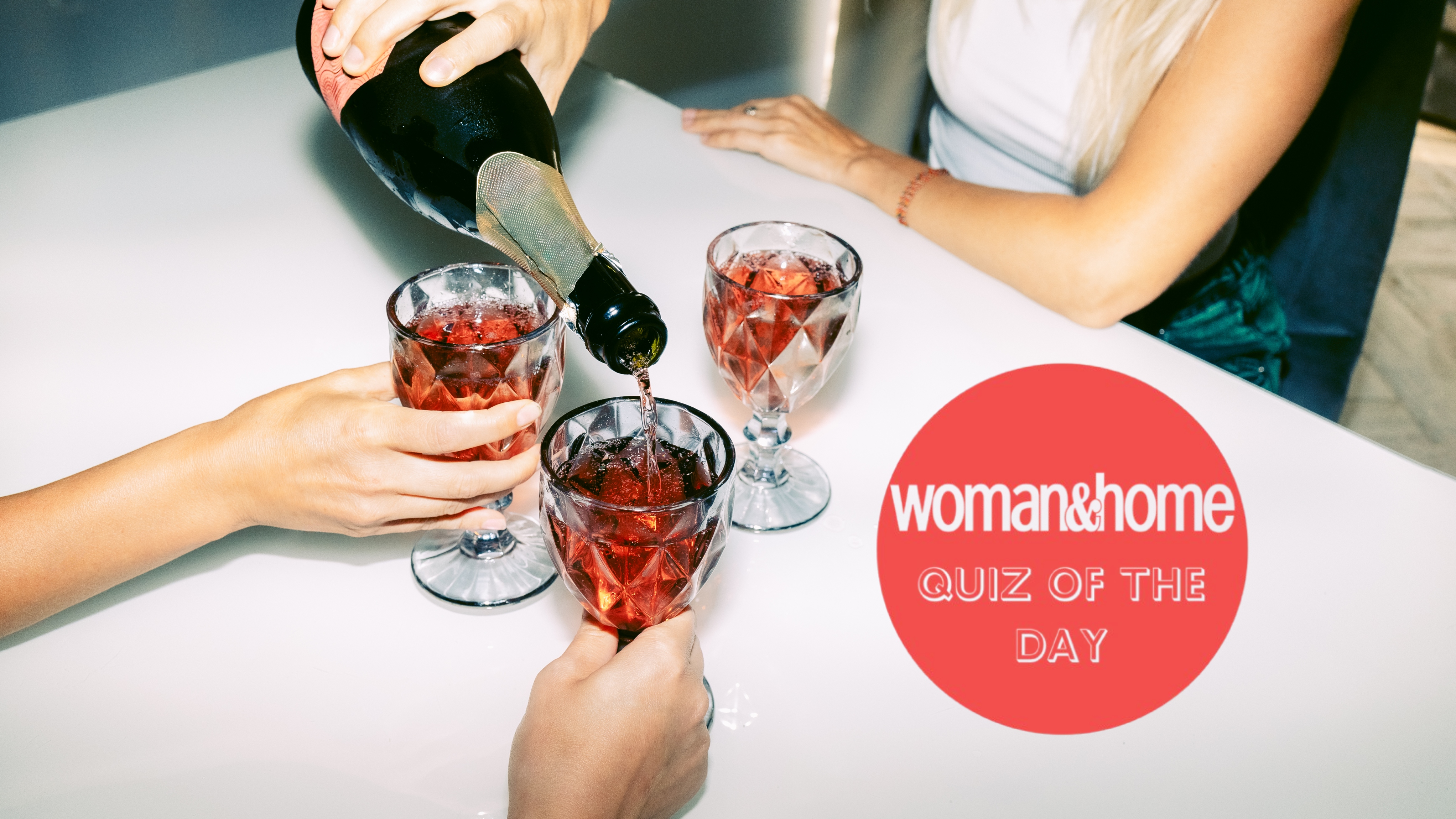 woman pouring glasses of champagne