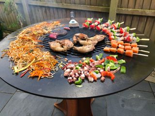 range of food cooking on an Arteflame from UK Grills