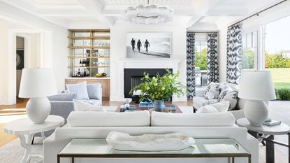 living room with white walls and white sofa with gray accents