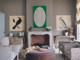 Eclectic living room with two sofas and an alcove, decorated with wall art