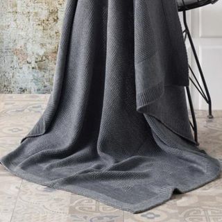 gray throw blanket from wayfair on a chair