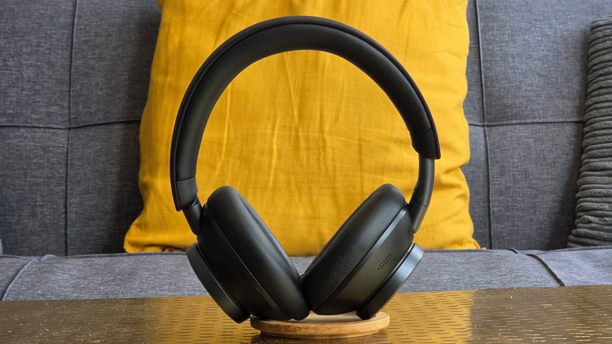 The Earfun Wave Pro X stood up on a sofa.