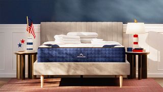 The DreamCloud mattress decorated with red, white and blue for Presidents' Day mattress savings