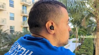 reviewer wearing Sennheiser CX Plus earbuds