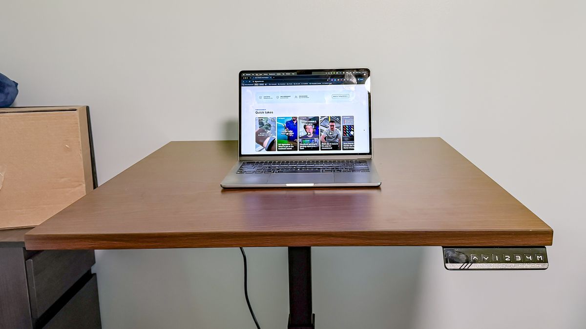 Progressive desk with laptop on it