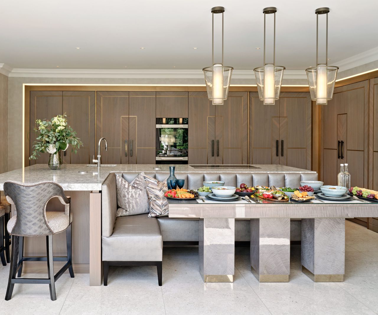 main kitchen with back kitchen area hidden by pocket sliding doors in cream with gold detailing