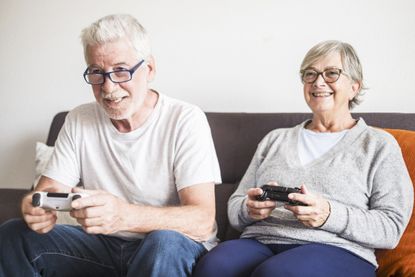 Two adults playing a video game