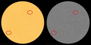 The instruments onboard NASA's orbiting Solar Dynamics Observatory captured imagery of the two sunspots from the new sunspot cycle on Dec. 24 — one in the sun's northern hemisphere and one in the southern hemisphere, shown here circled in red.