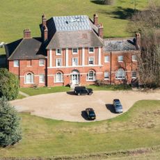 A photo of Forest Lodge with cars in front