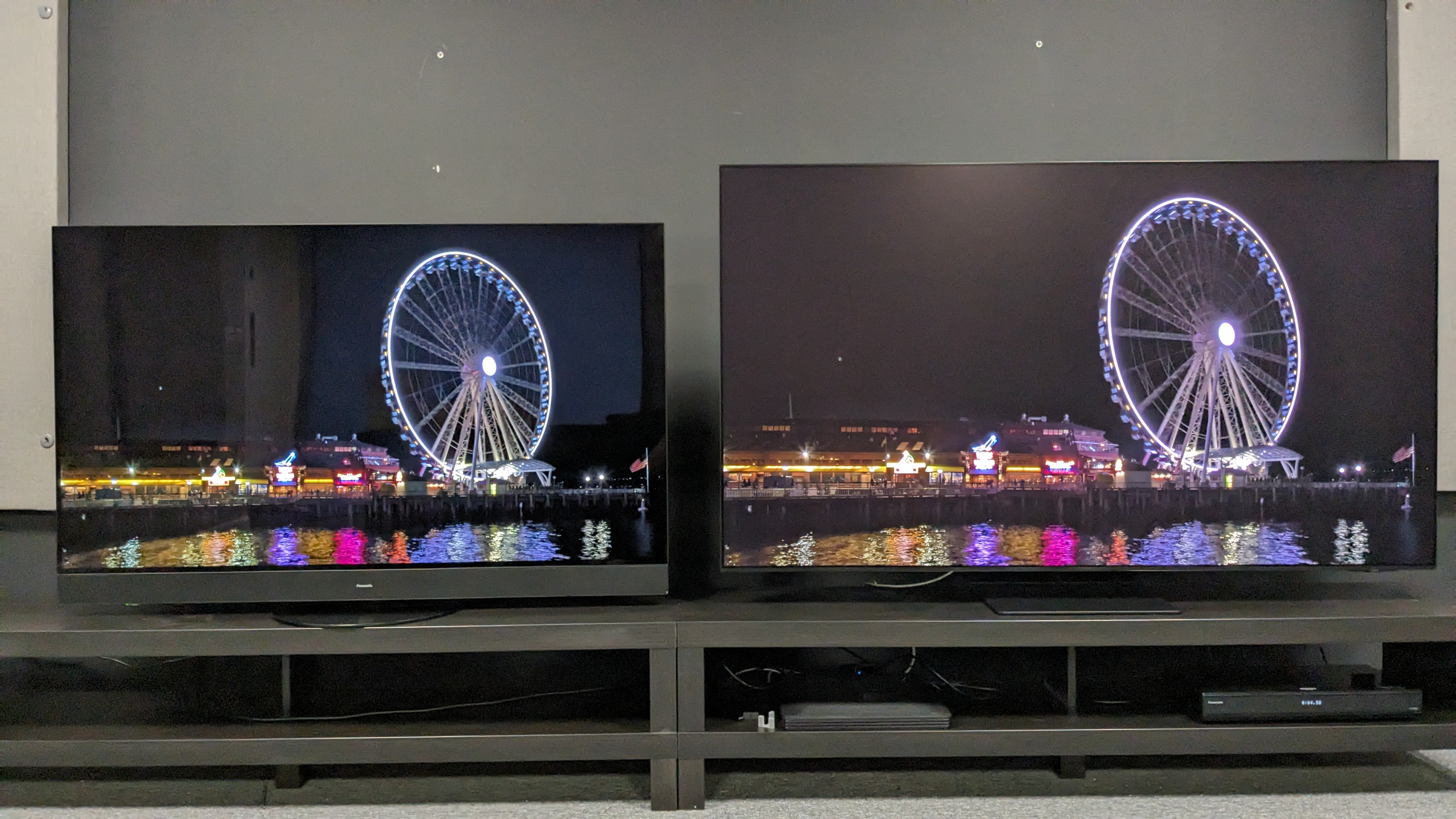 Samsung S95D and Panasonic mZ1500 with ferries wheel on screen