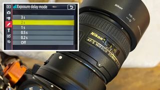 Nikon AF-S 50mm f/1.4G with inset rear LCD screen showing Exposure delay mode options