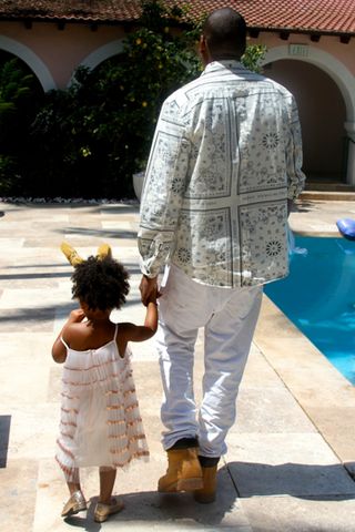 Blue Ivy and Jay-Z take a walk by the pool