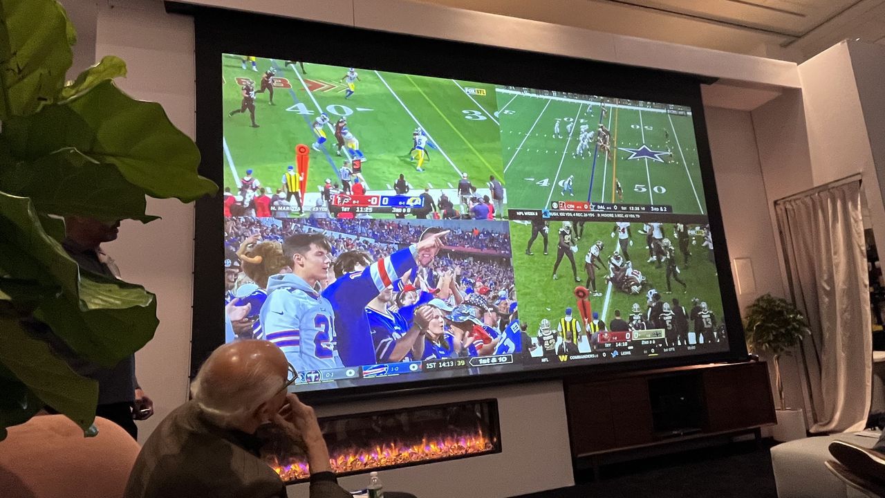 home theater projection screen showing image of NFL football game