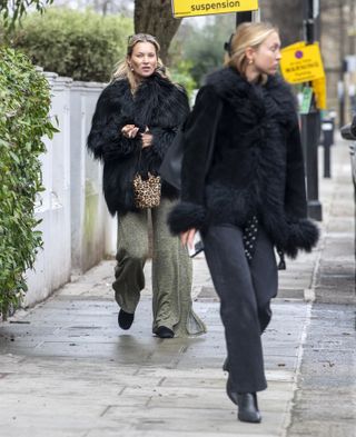 Kate Moss and Lila Moss wear fur jackets.