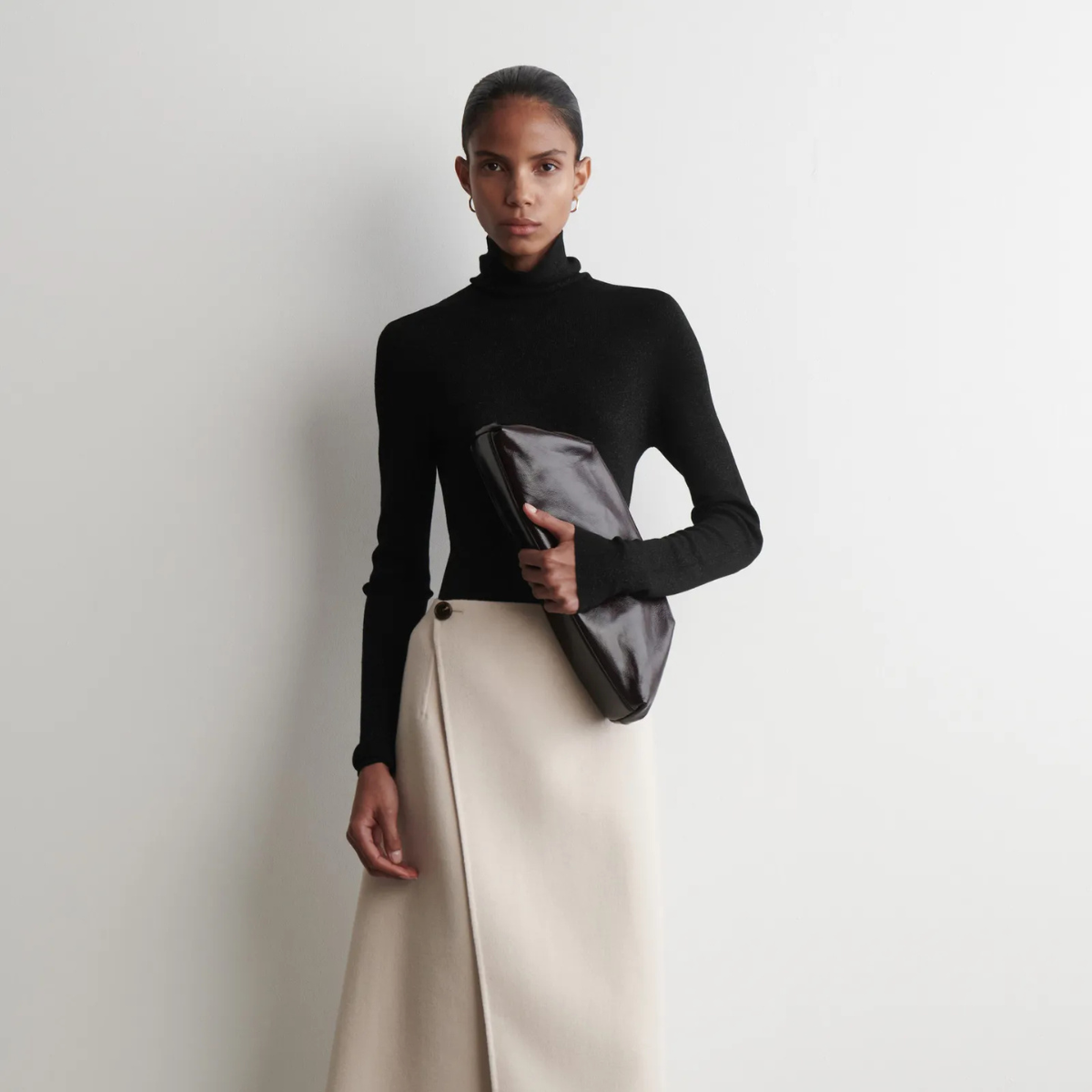 A chic skirt, clutch and top from COS