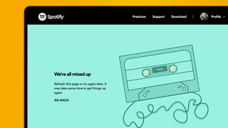A laptop screen on an orange background showing a Spotify Wrapped 2023 error page