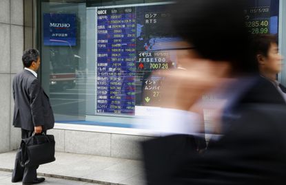 A man looks at the Chinese stock exchange