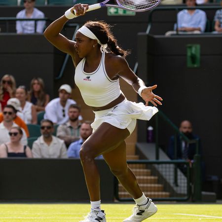 Coco Gauff wearing her Miu Miu x New Balance Wimbledon two-piece set.