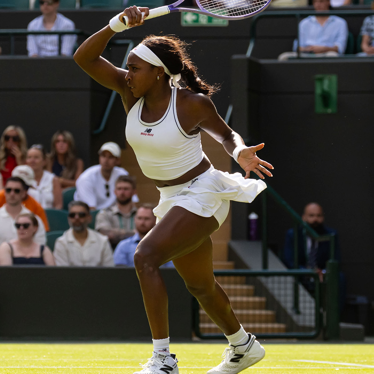 Coco Gauff wearing her Miu Miu x New Balance Wimbledon two-piece set.
