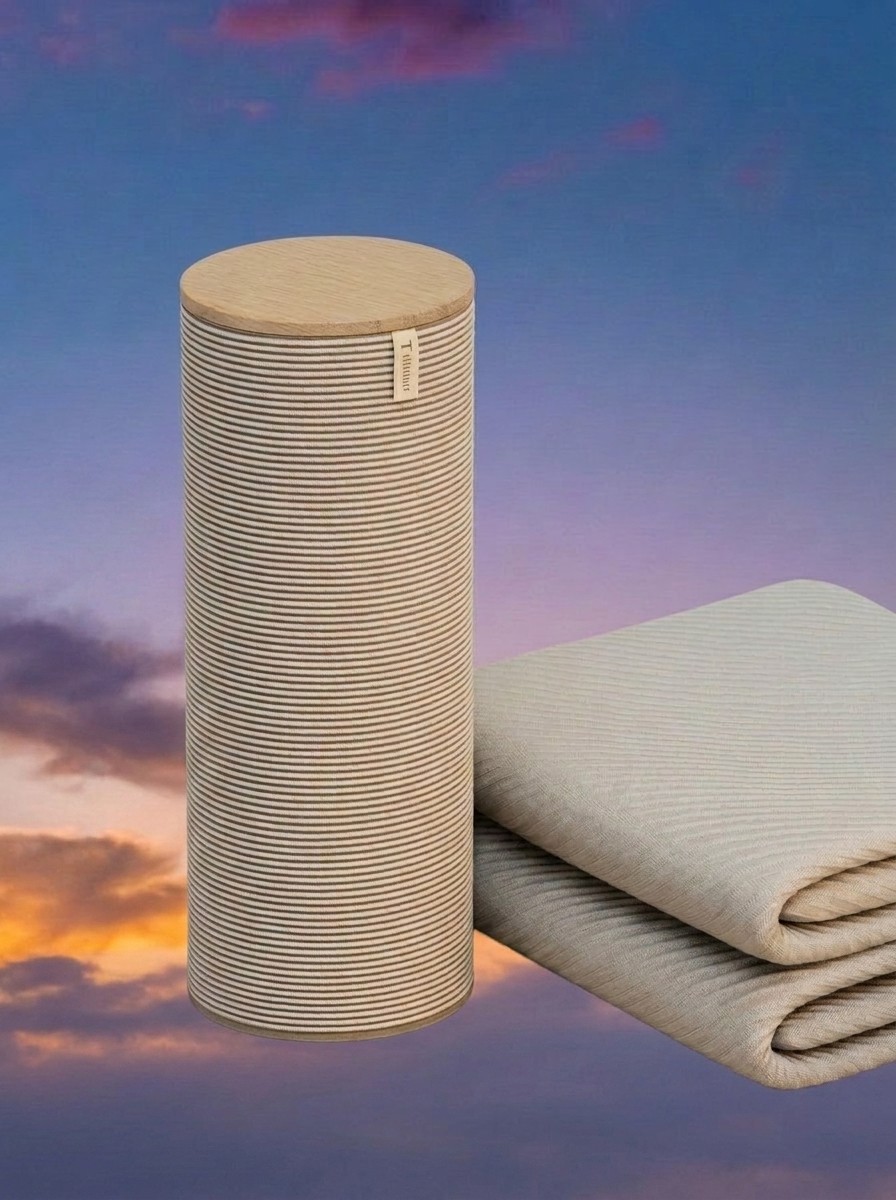 The Orion Sleep System and mattress cover (folded) against a background of a dark sky edited by Gemini