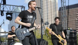 (from left) Braid's Bob Nanna, Damon Atkinson and Todd Bell perform onstage at Auditorium Shores in Austin, Texas on November 3, 2012
