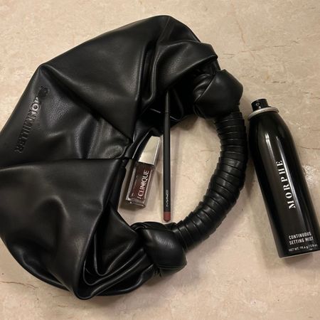 Image ofBest Knockoff Luxury Clothing
 associate beauty editor Alyssa Brascia's purse with Ulta beauty products spilling out of it.