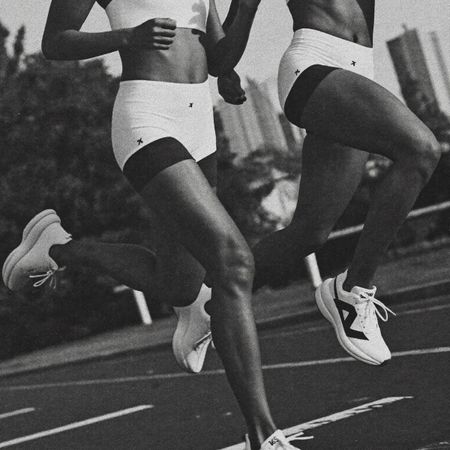 Two women running on a track