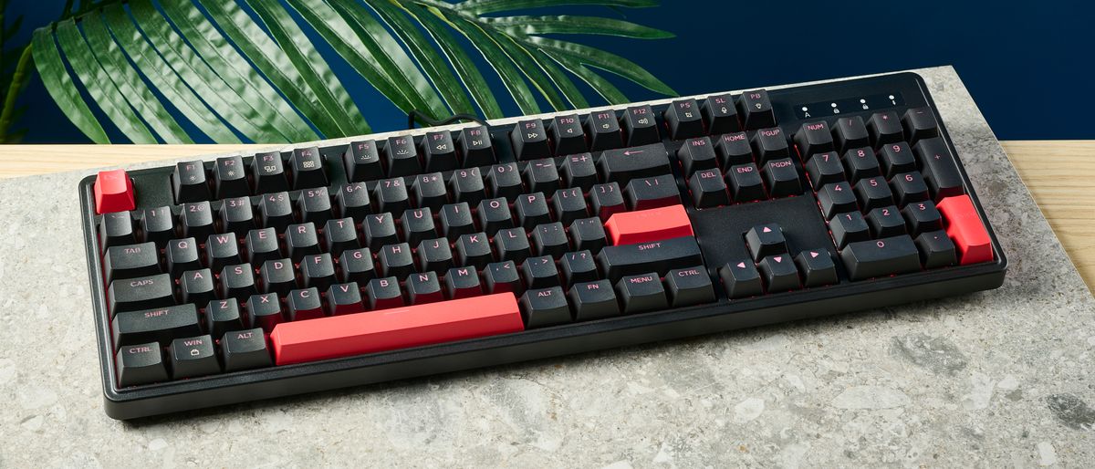 A black Lemokey X3 wired gaming keyboard with red keycaps