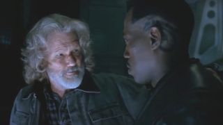 Kris Kristofferson looks at Wesley Snipes in mid-conversation in Blade II.