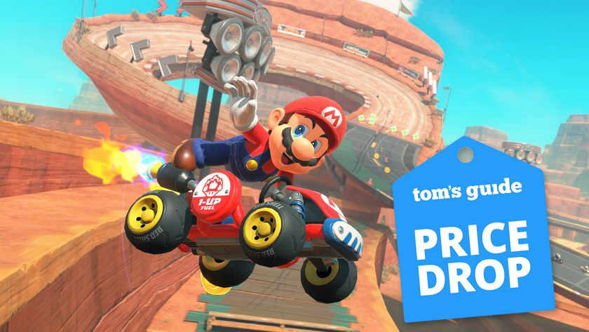 Mario kart world with price drop sticker, featuring mario in a red kart performing a stunt